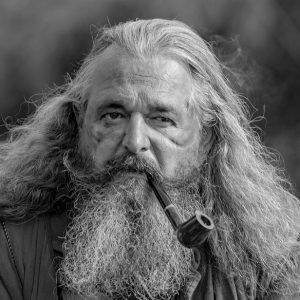 Hairy person with a pipe