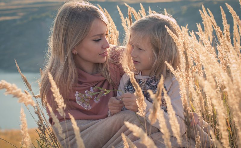 Mother and daughter posing