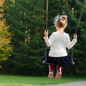 Childing swinging on a swing