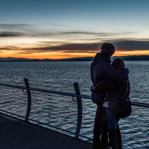 Lovers looking into distance