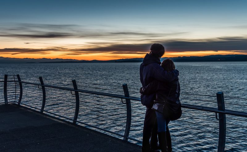 Lovers looking into distance