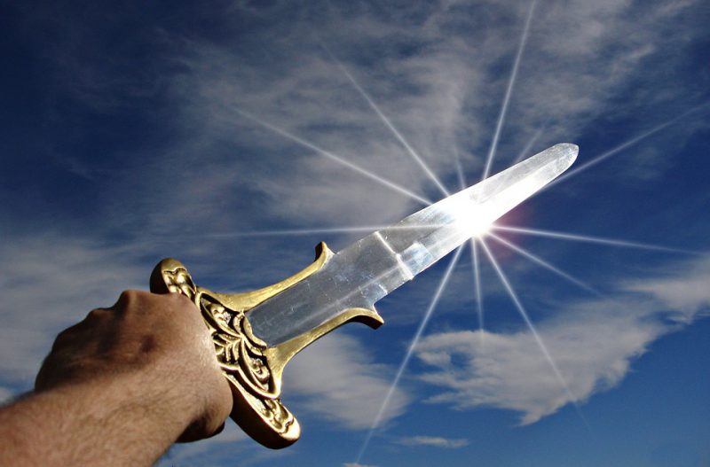 Light glowing on a sword