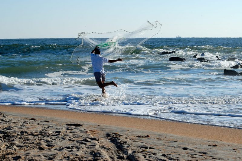 Guy throwing fishing net