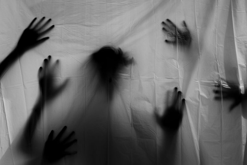 Ghosts behind white sheet