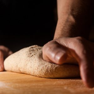 Baker preparing dough