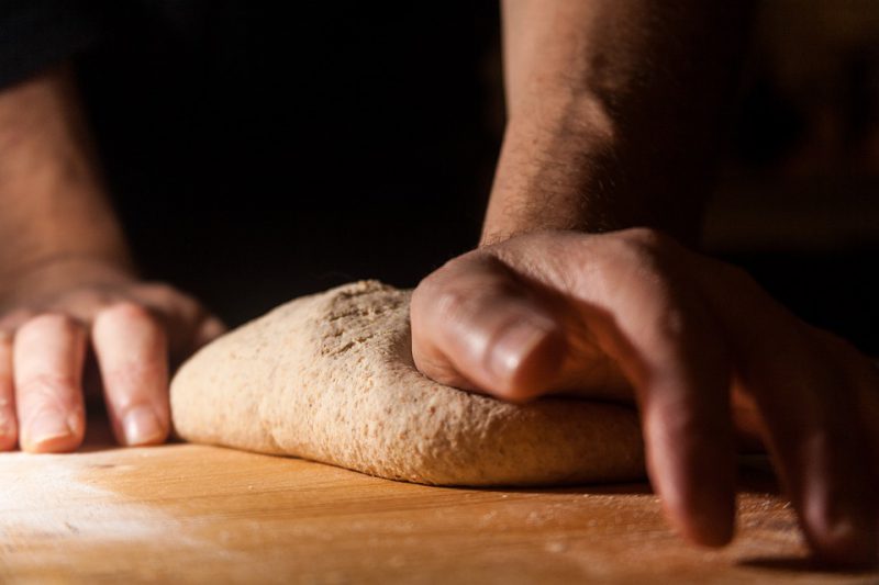 Baker preparing dough