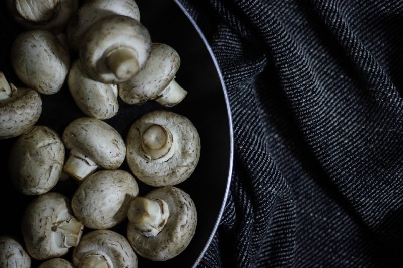 Button mushrooms in a pan