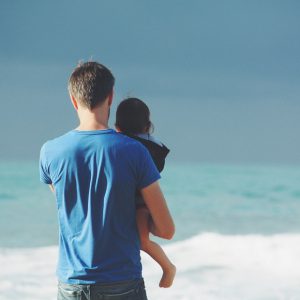 Father and child on a beach