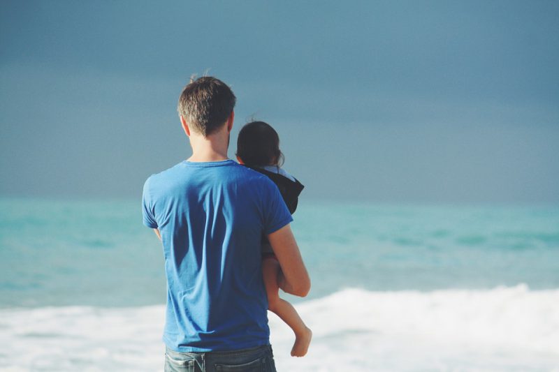 Father and child on a beach