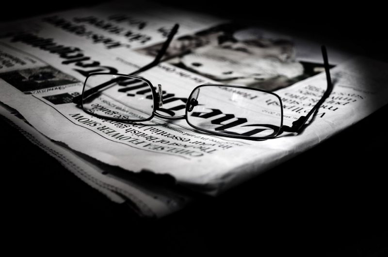 Glasses on a newspapers