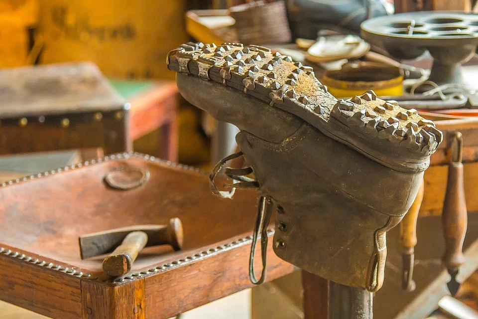 Shoemaker fixing old shoes