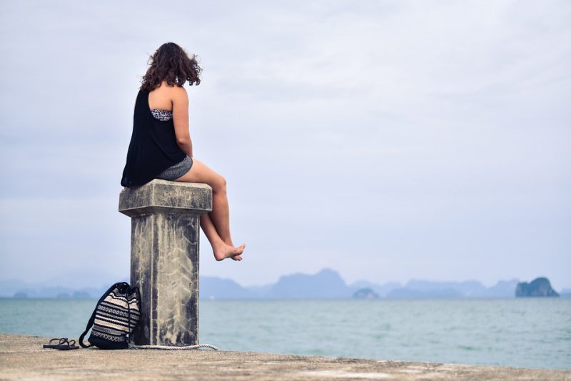 Girl alone on a dock