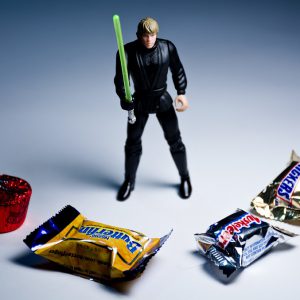 Action figure surrounded by various sweets