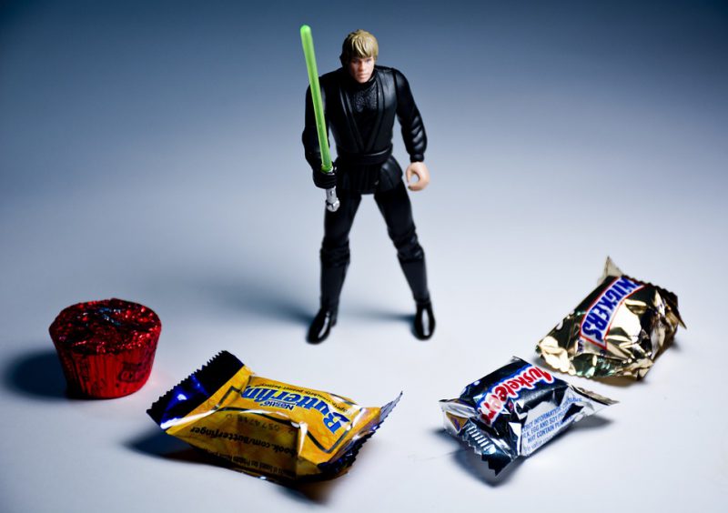 Action figure surrounded by various sweets