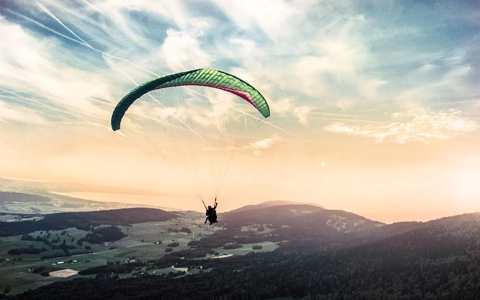 Paratrooper in the air with a panorama below