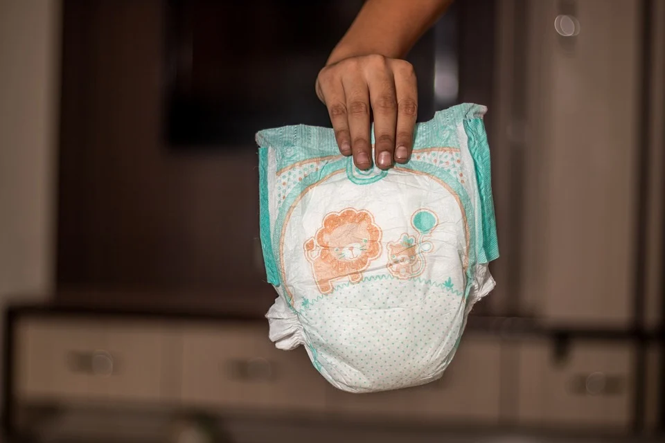A person is holding a diaper