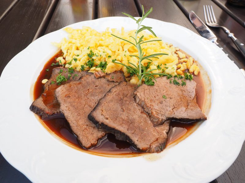Roast meat and rice served on a plate