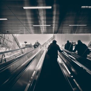People move on escalators