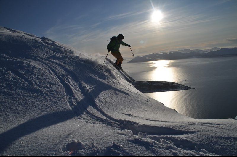 A person skis down a mountain