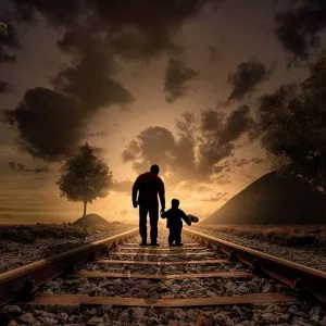Father and son are walking on the railway