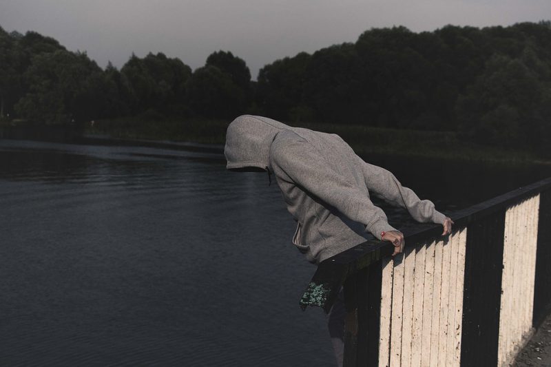 A man tries to jump from a bridge