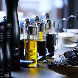Vinegar and oil served on a table