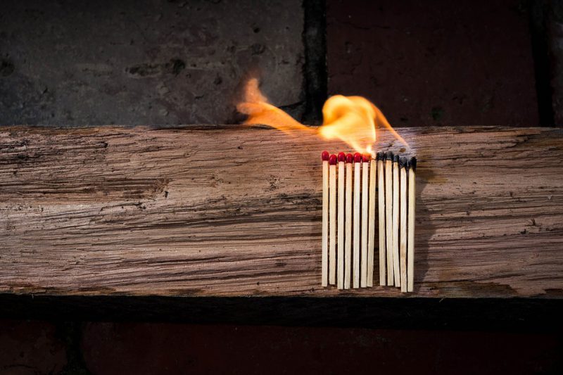 Matchsticks lined up and lit