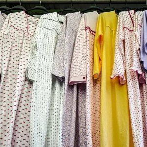 Nightgowns lined up on hangers