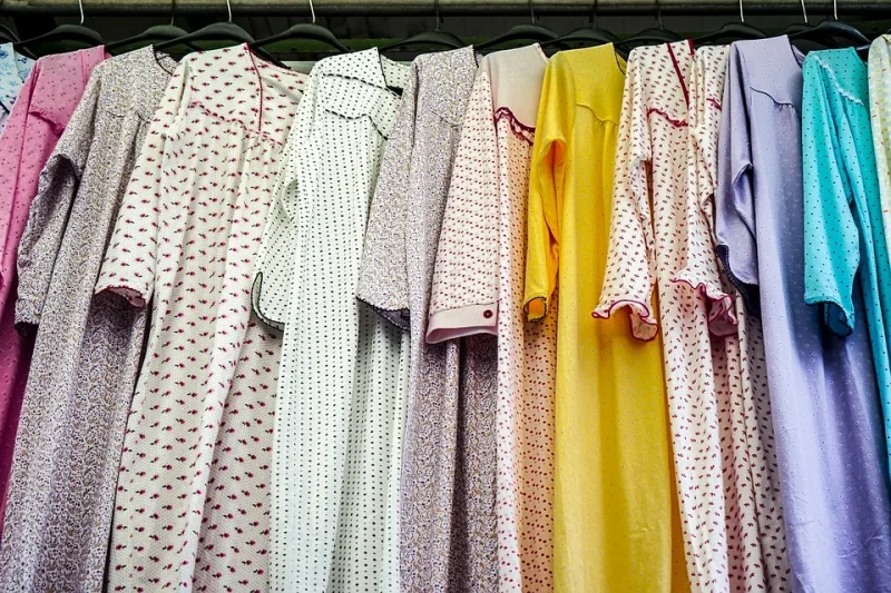 Nightgowns lined up on hangers