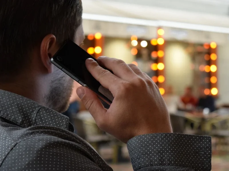 A man is talking on a cell phone