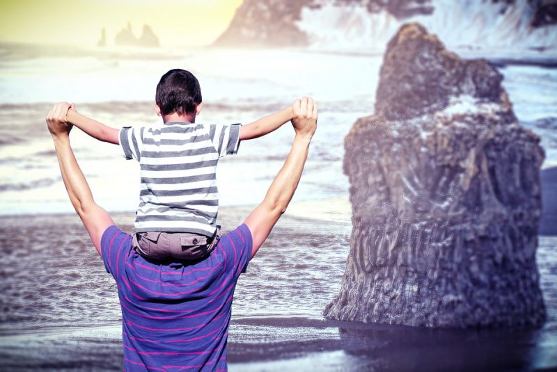 Uncle and nephew playing on the seashore