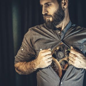 Man unbuttoning shirt