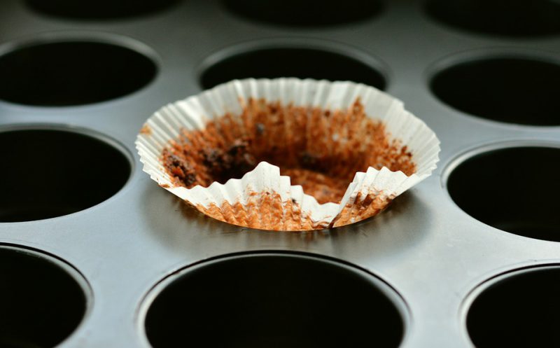 Used muffin paper left on muffin tray