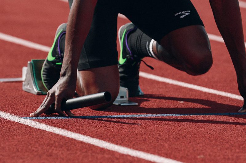 A runner at the start with a relay