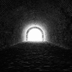 A tunnel with a bright light at the end