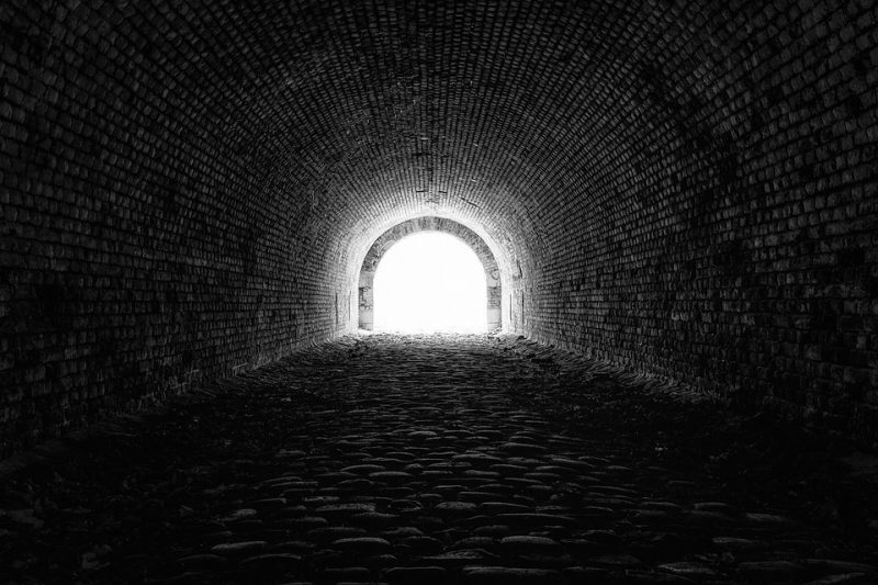 A tunnel with a bright light at the end