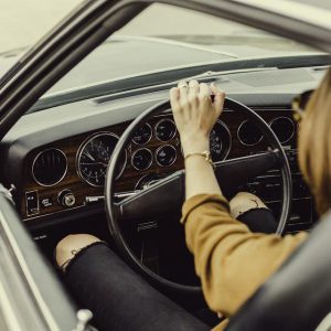 A woman drives a car