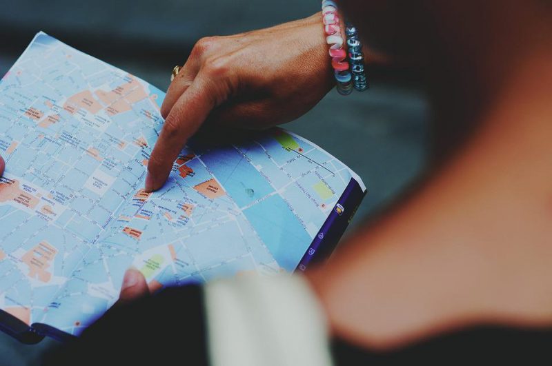 A person is holding a tourist guide map