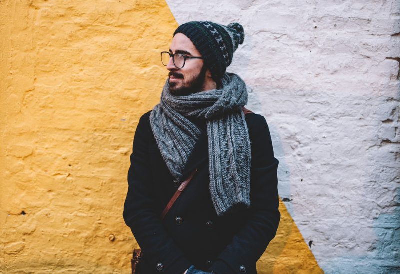 A woolen scarf wrapped around a man's neck