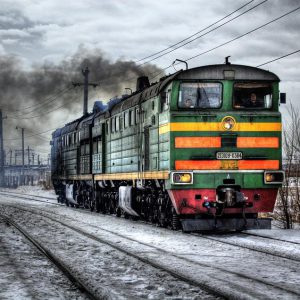 The train goes along the track in the cold winter season