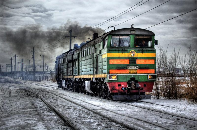 The train goes along the track in the cold winter season