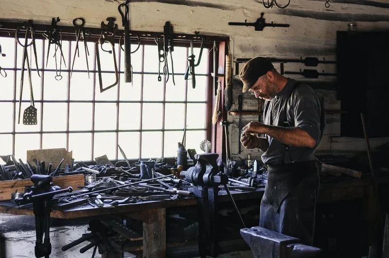 Craftsman is making something in his workshop