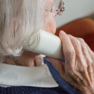 Old woman speaking on the phone