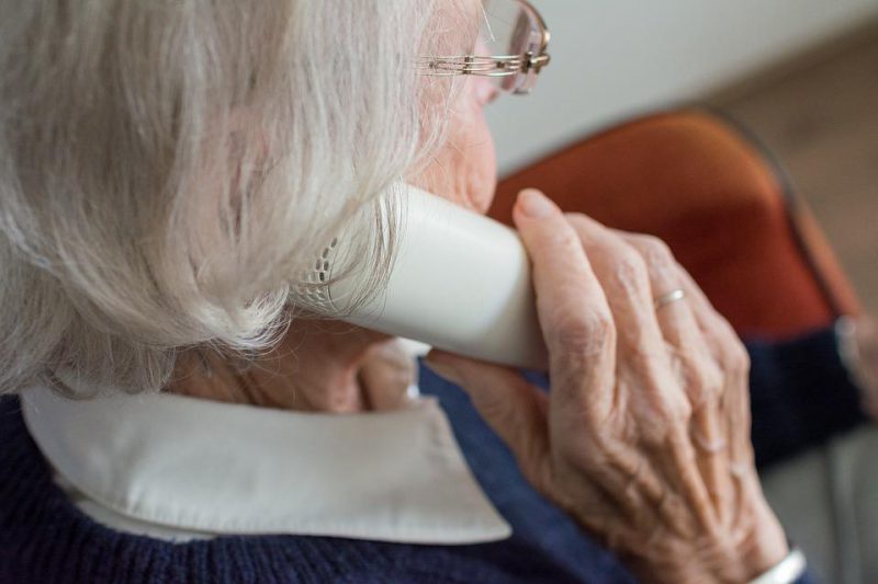 Old woman speaking on the phone