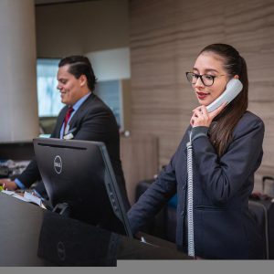 Woman receptionist calling someone