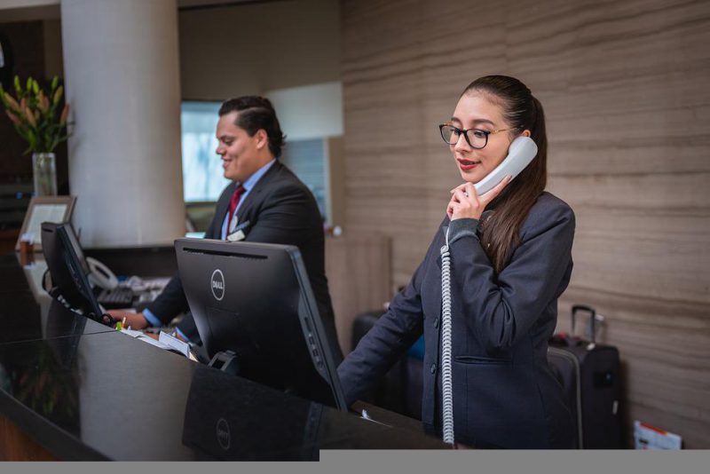 Woman receptionist calling someone