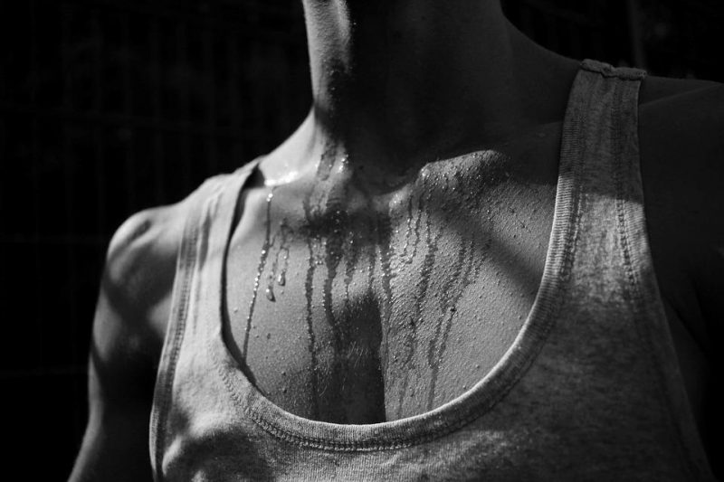 Sweat trickling from the neck and chest