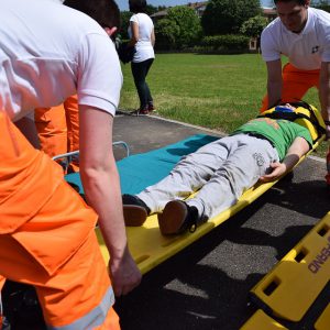 Paramedics carrying a wounded person on a strecher
