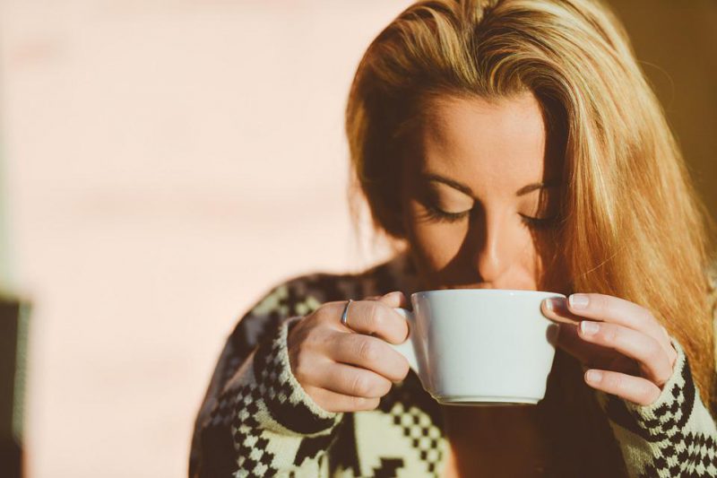 Woman drinking something